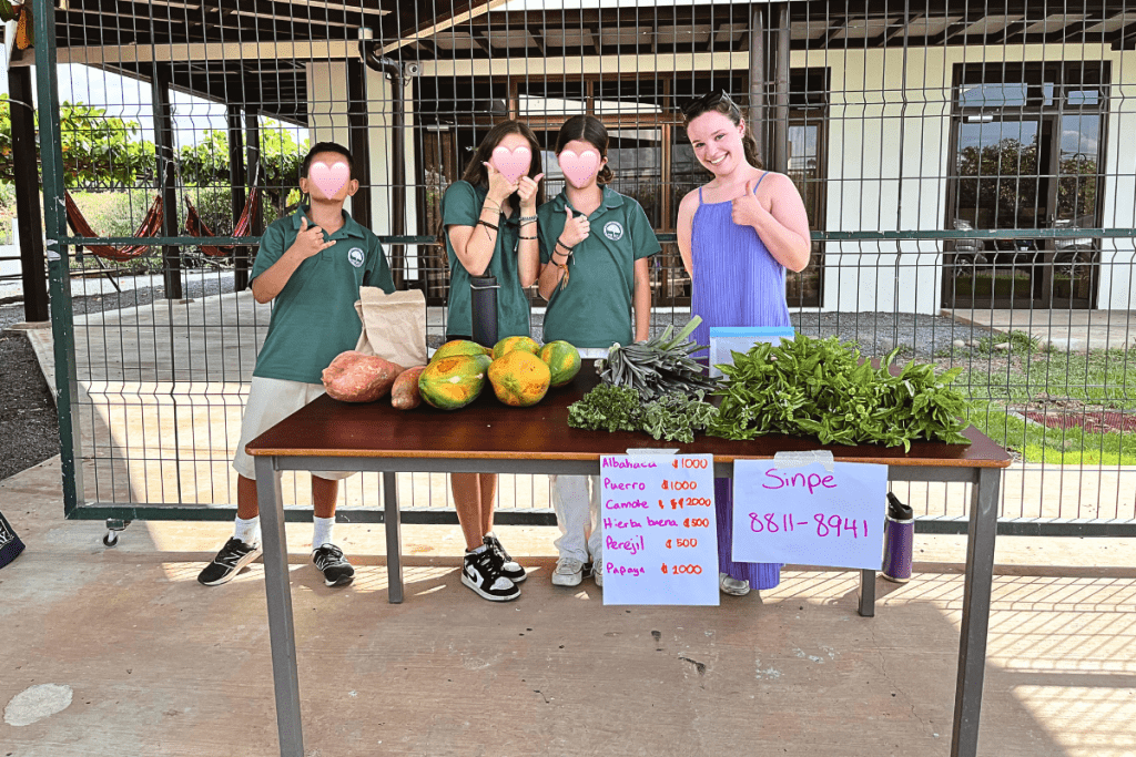 Students at a Costa Rican international school selling organic vegetables that they had grown.