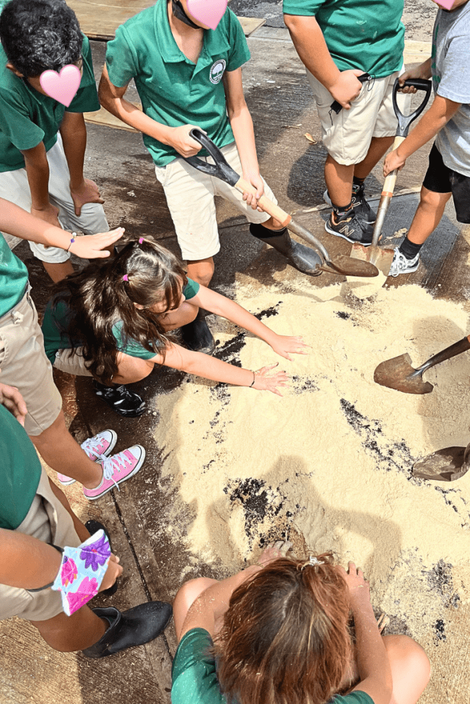 Students at a Costa Rican international school working with materials to be used in the garden.